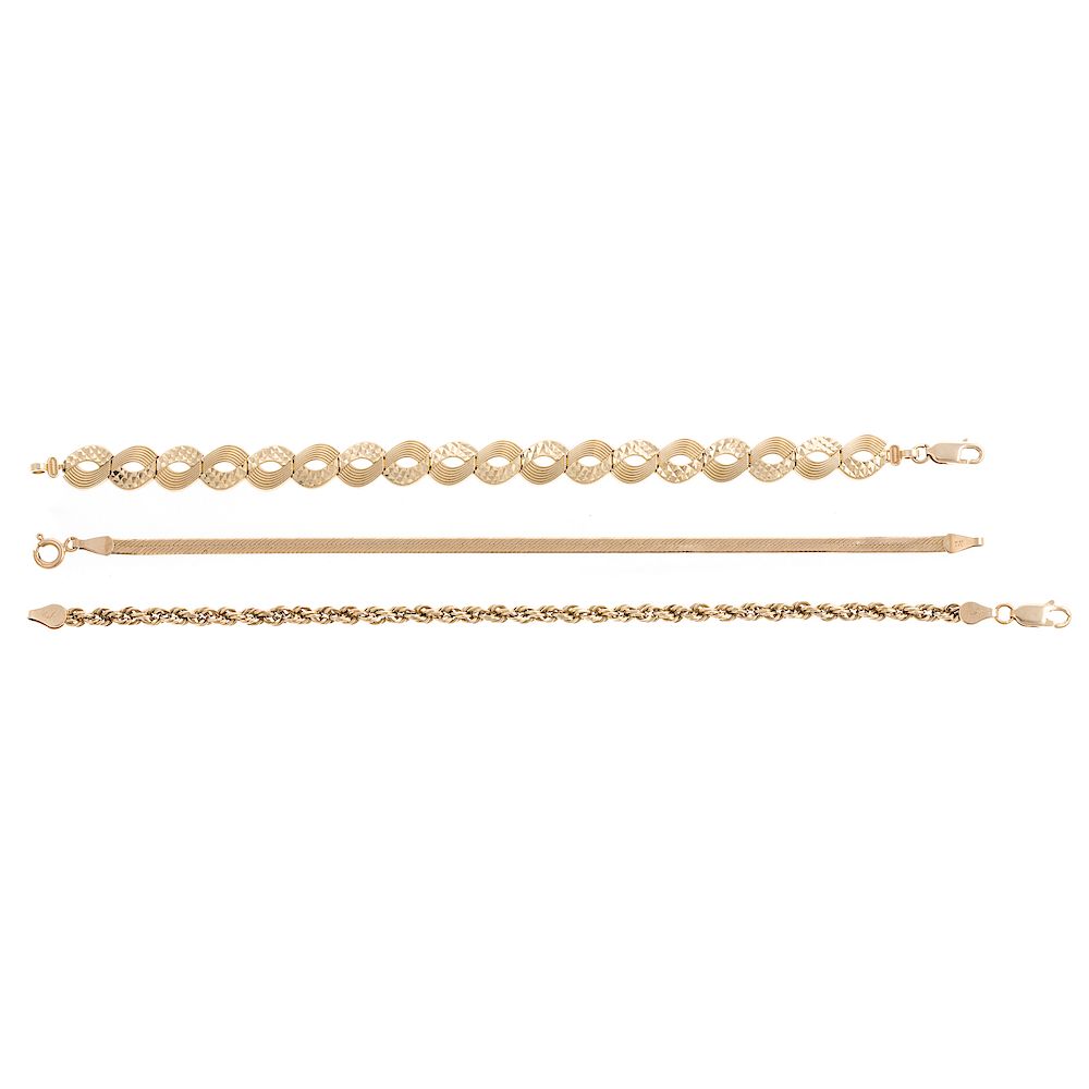 Appraisal: A Trio of Ladies Gold Bracelets K yellow gold textured