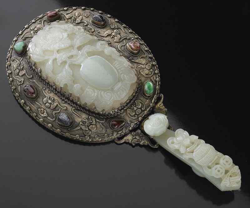 Appraisal: Chinese Qing silver mounted jade mirror the plaque depicting peony