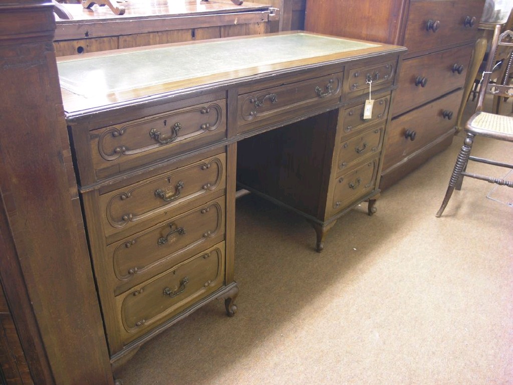 Appraisal: An early th century mahogany desk inset vinyl top above