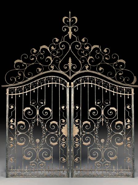 Appraisal: A pair of Continental wrought iron gilt decorated estate gates