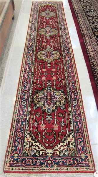 Appraisal: HAND KNOTTED ORIENTAL CORRIDOR RUG Persian Serapi design featuring five