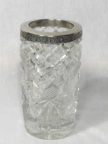 Appraisal: A Latvian hallmarked silver mounted deeply cut glass vase circa