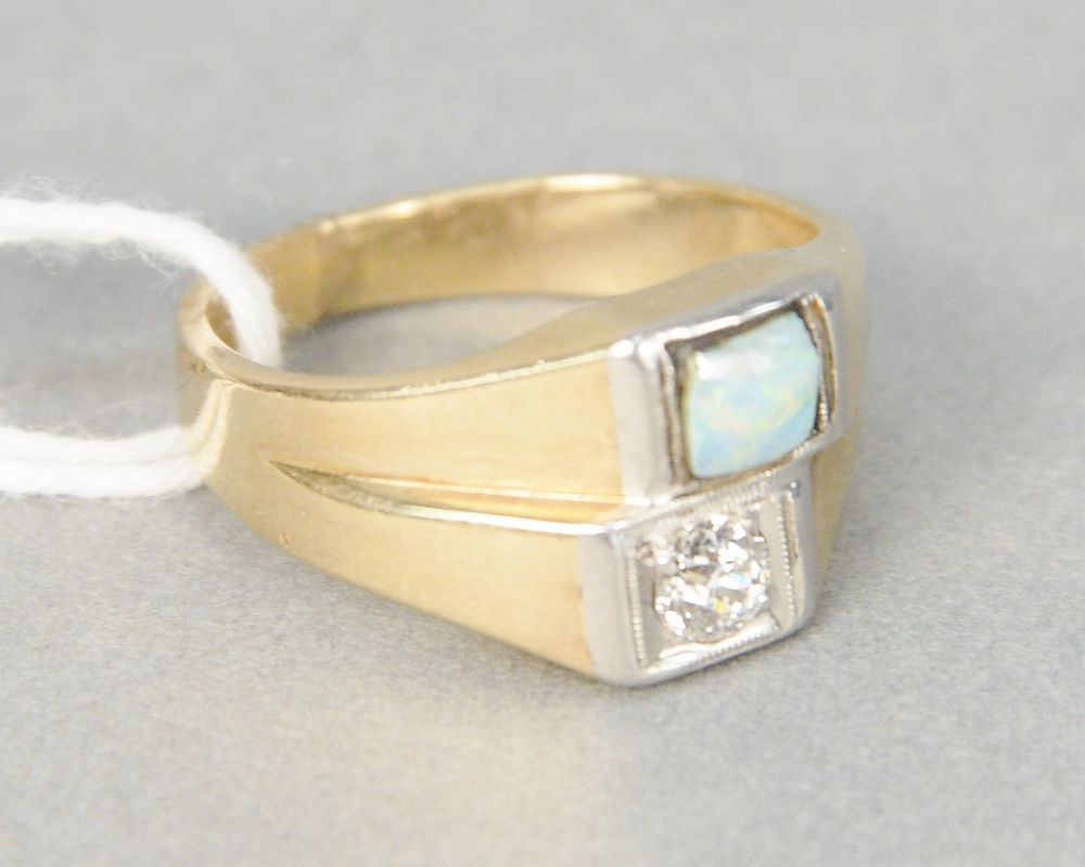 Appraisal: karat yellow gold ring set with diamond and opal grams