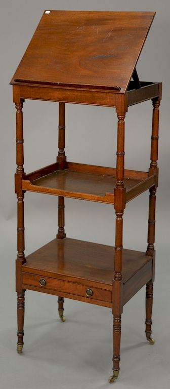 Appraisal: Continental mahogany three tier etagere with folding top and one