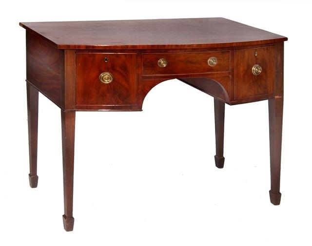 Appraisal: A George III bowfronted sideboard with one long central drawer