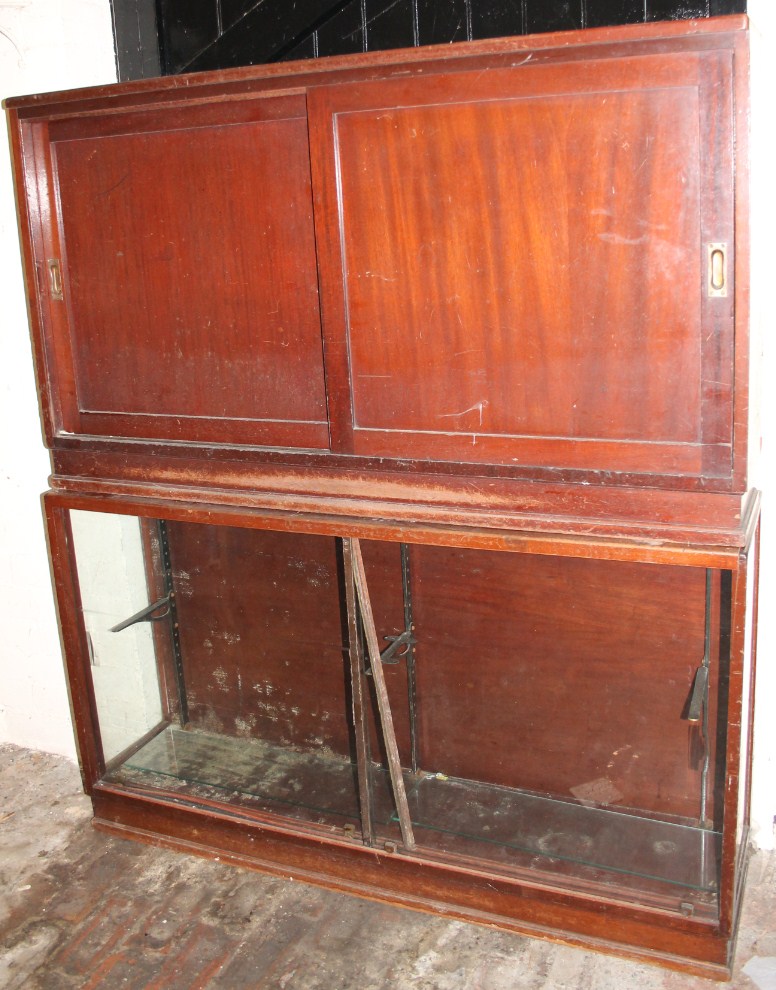 Appraisal: A late thC glazed display cabinet with associated base with