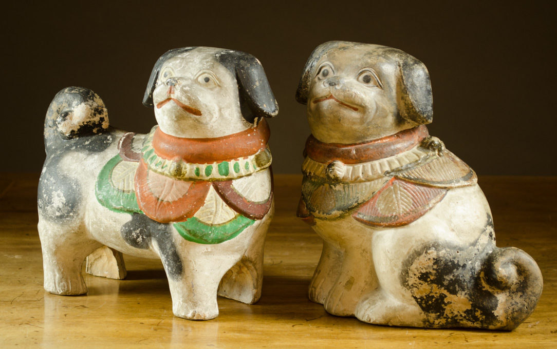 Appraisal: TWO CHINESE TERRA COTTA DOG SCULPTURES with hand painted features