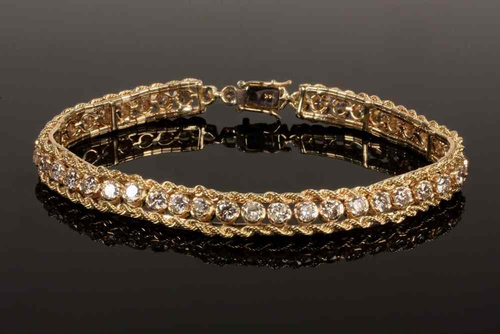 Appraisal: LADY'S BRACELET - One K yellow gold tennis style bracelet