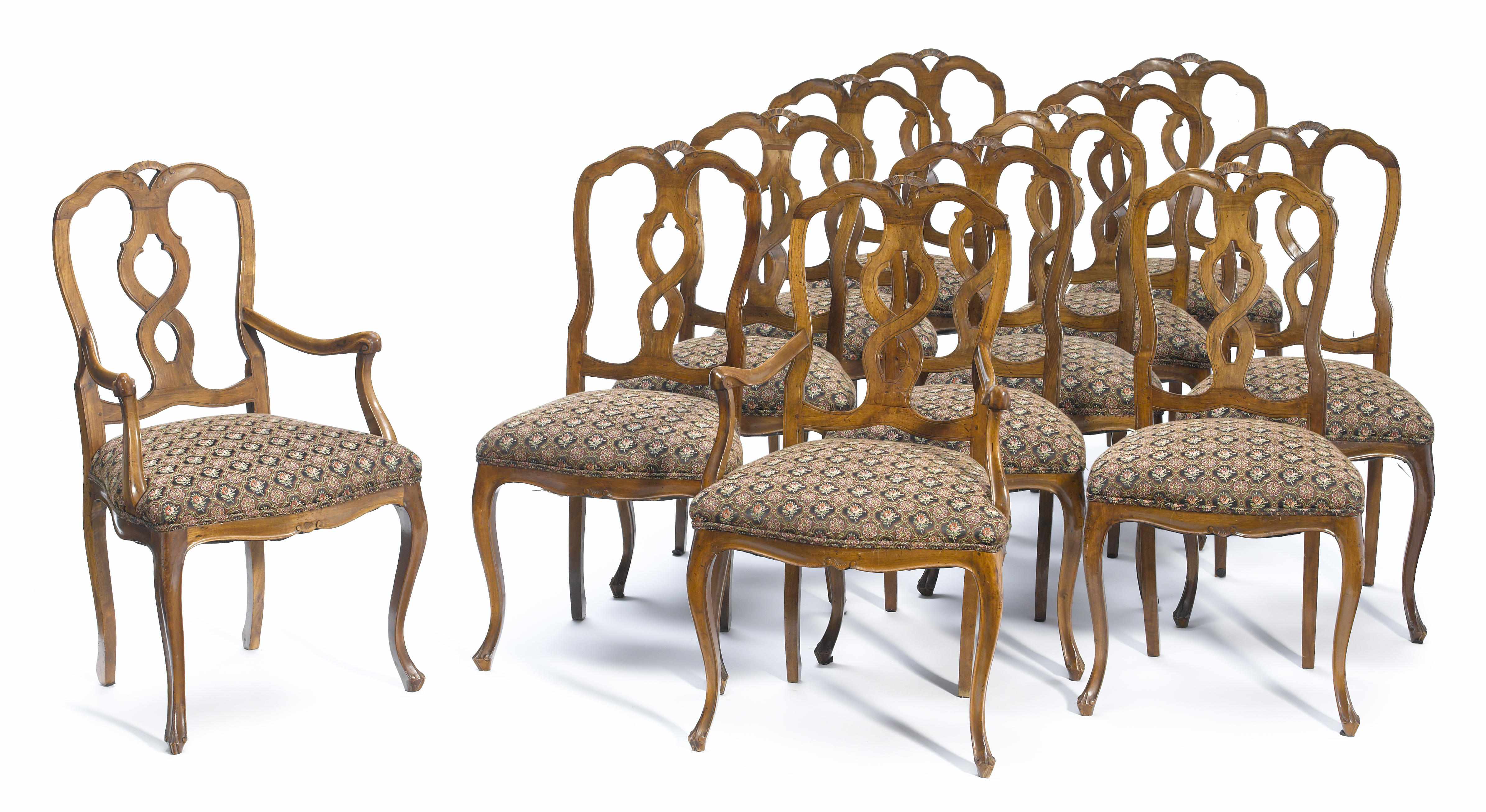 Appraisal: A set of twelve Italian Rococo style walnut dining chairs