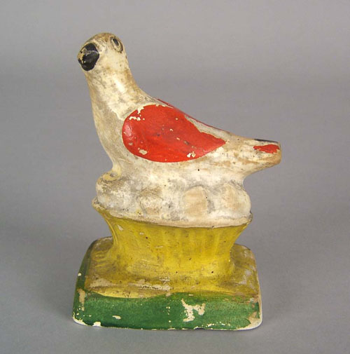 Appraisal: Chalkware bird on nest th c h