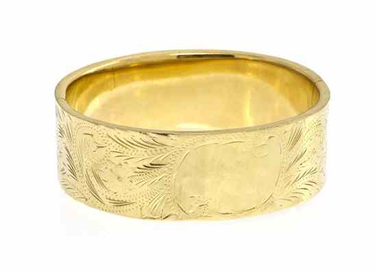 Appraisal: A Karat Yellow Gold Hinged Bangle Bracelet engraved with a