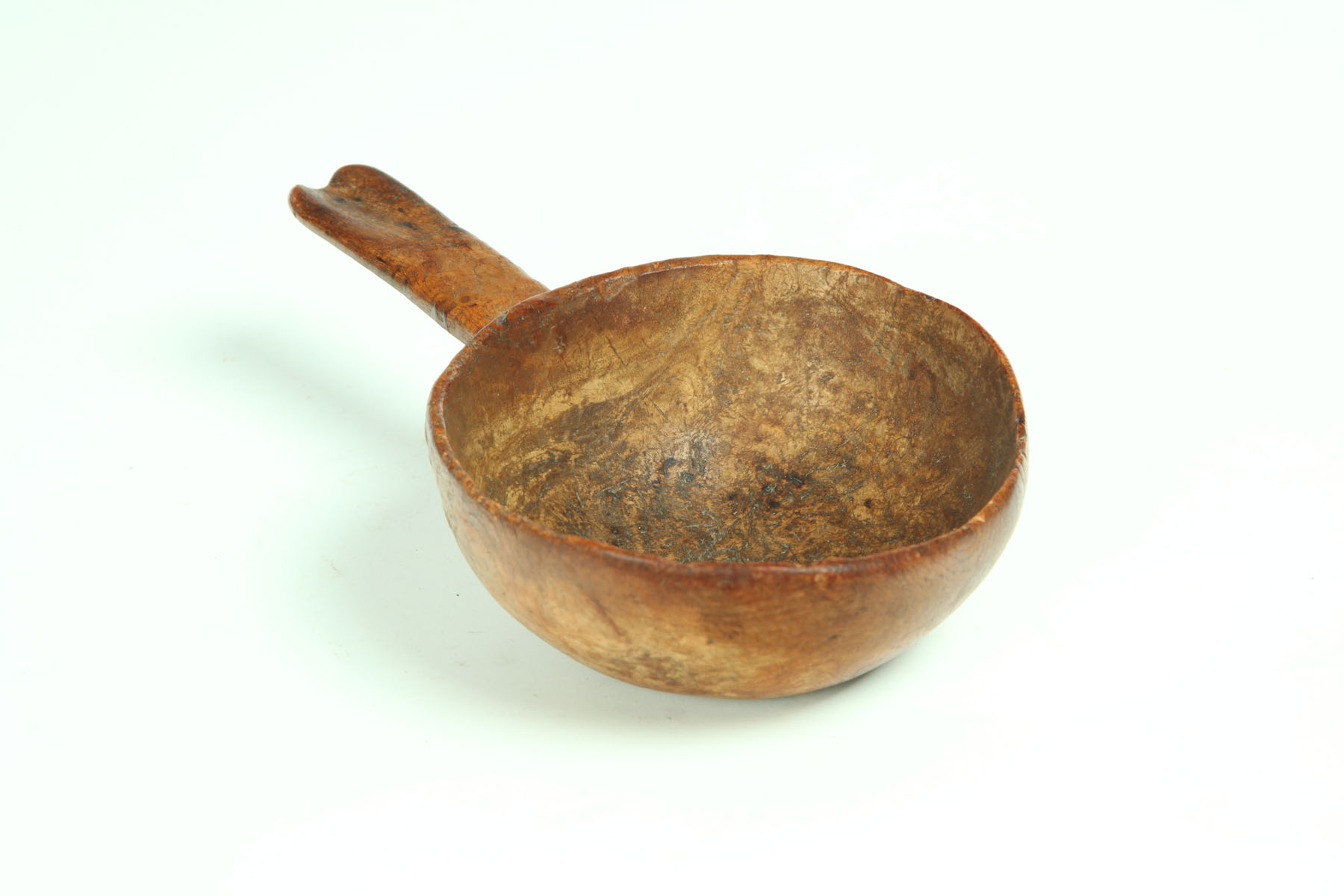 Appraisal: BUTTER SCOOP American th century burl Scalloped edge handle Age