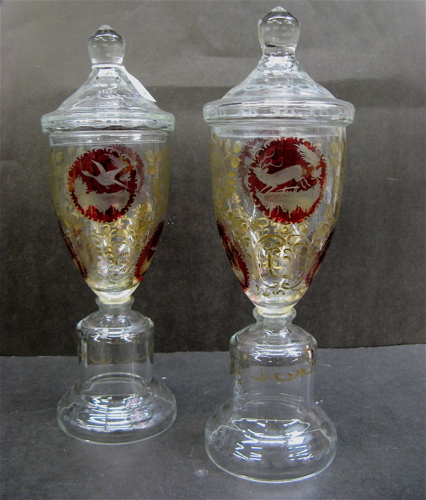 Appraisal: PAIR BOHEMIAN RUBY AND CLEAR GLASS POKALS the covered garnitures