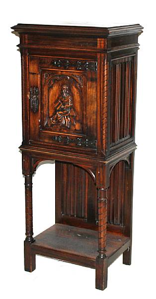 Appraisal: A Gothic style walnut music cabinet late th early th