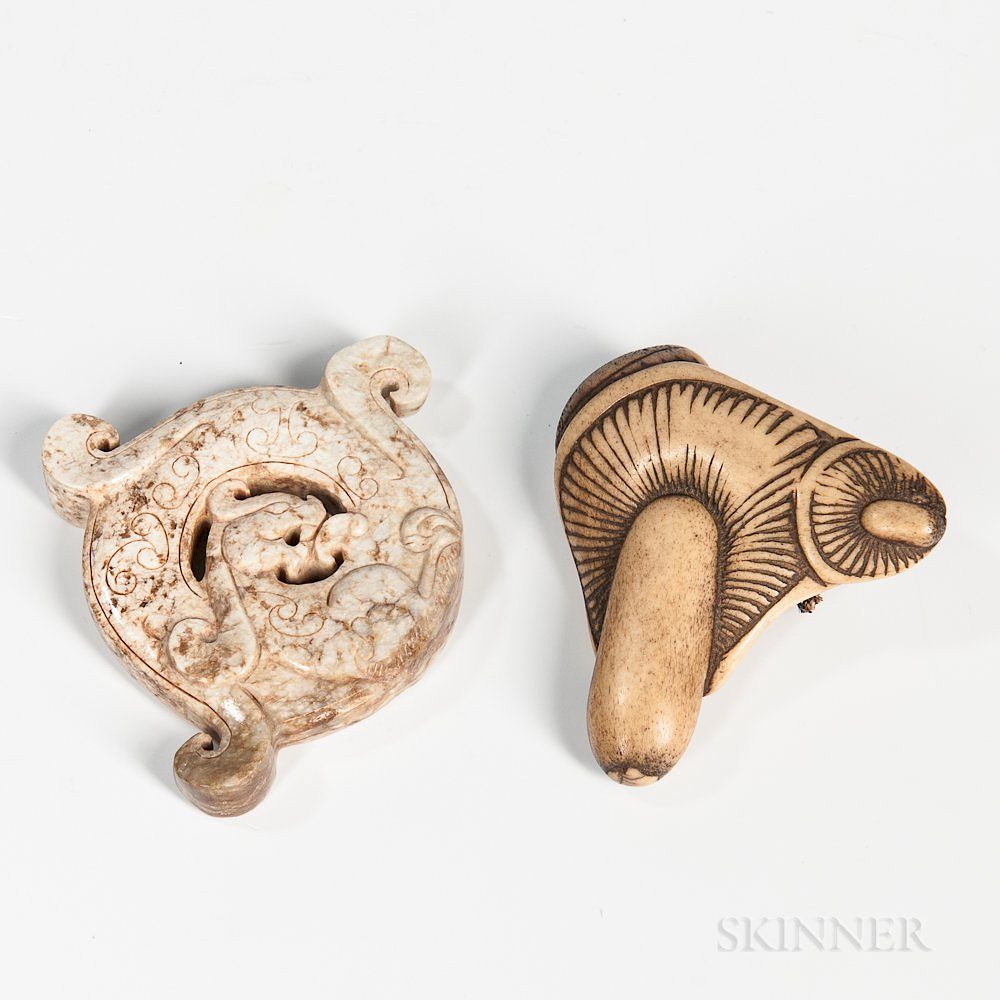 Appraisal: Archaic Hardstone Pendant and a Bone Netsuke Archaic Hardstone Pendant