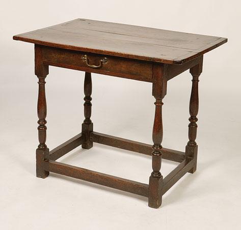 Appraisal: A GEORGE II OAK SIDE TABLE the rectangular top with