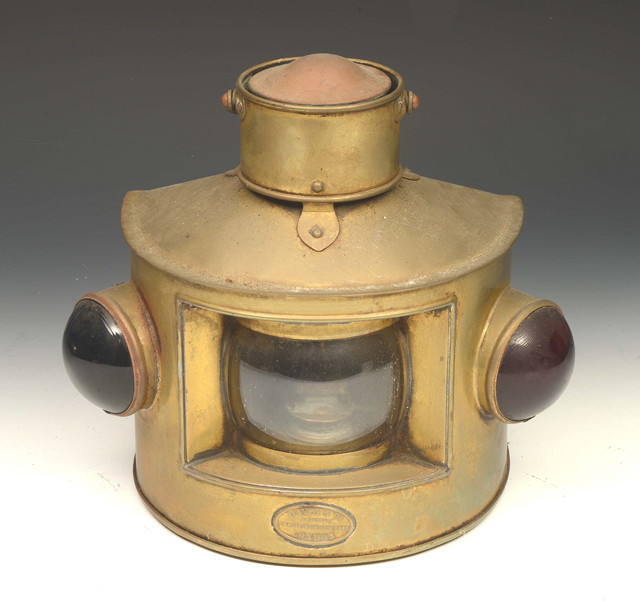 Appraisal: A 'D' SHAPED BRASS SHIPS LANTERN with loop handle central