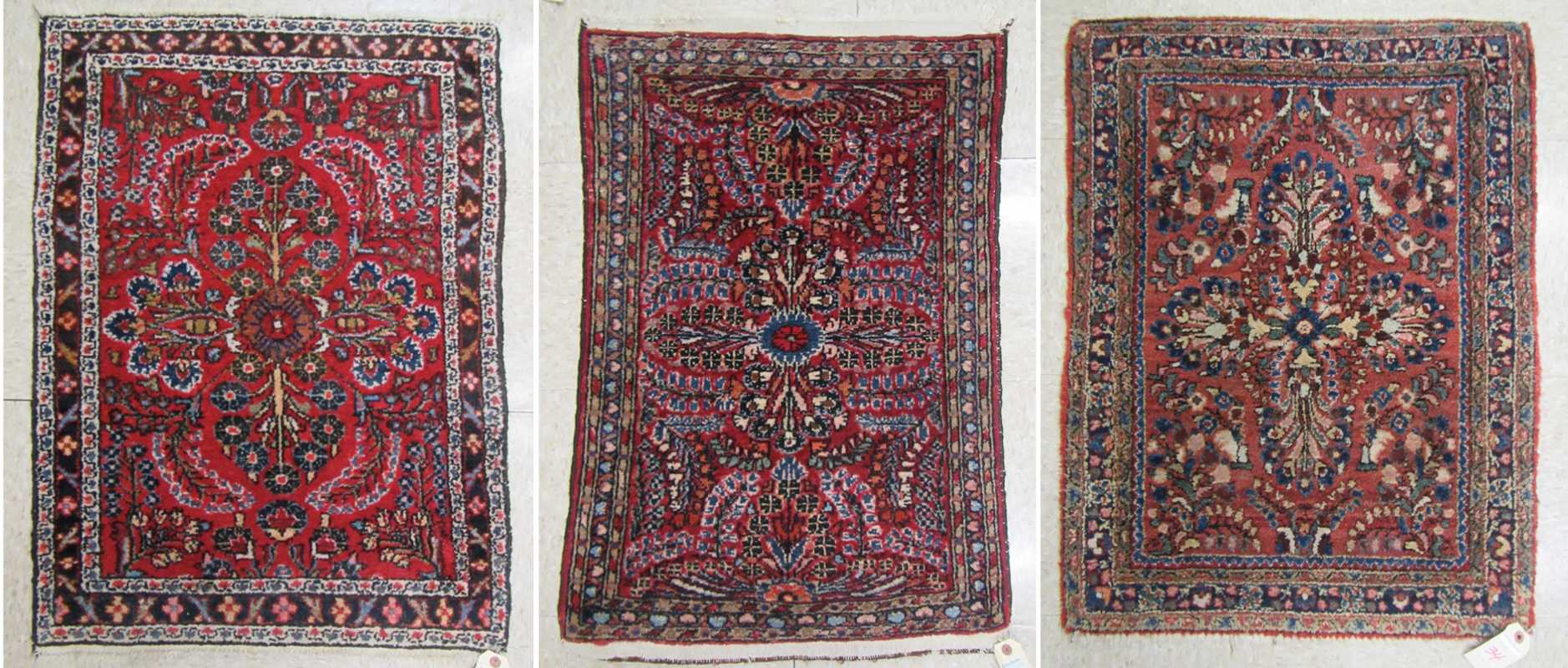 Appraisal: THREE SEMI-ANTIQUE PERSIAN MATS similar hand knotted floral patterns on