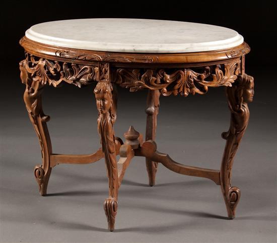 Appraisal: Continental carved and incised walnut marble-top oval stand with figural