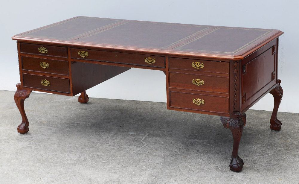 Appraisal: CONTEMPORARY CARVED BUREAU PLAT DESK Embossed leather inset top over