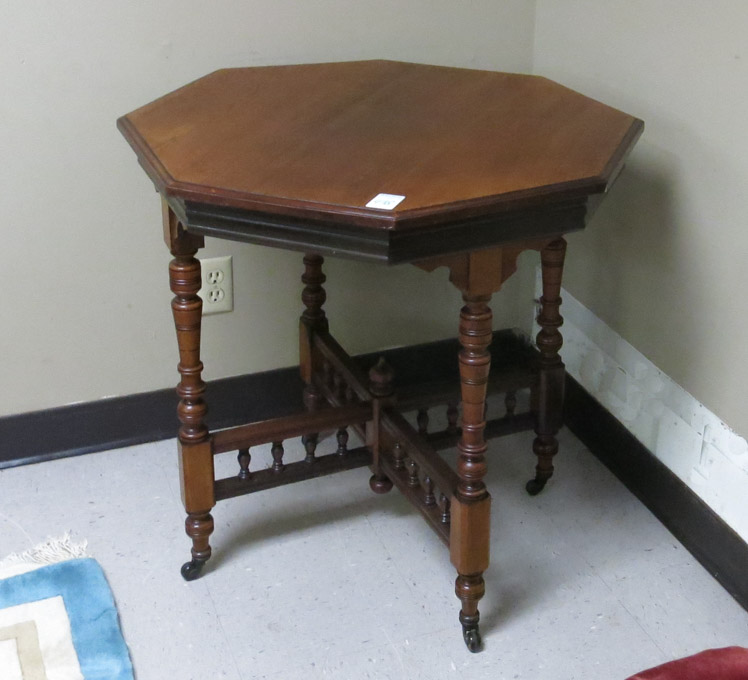 Appraisal: OCTAGONAL WALNUT AND MAHOGANY LAMP TABLE English Edwardian early th