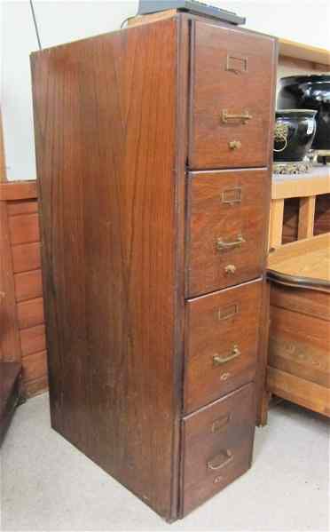 Appraisal: FOUR-DRAWER OAK FILE CABINET American c having a column of