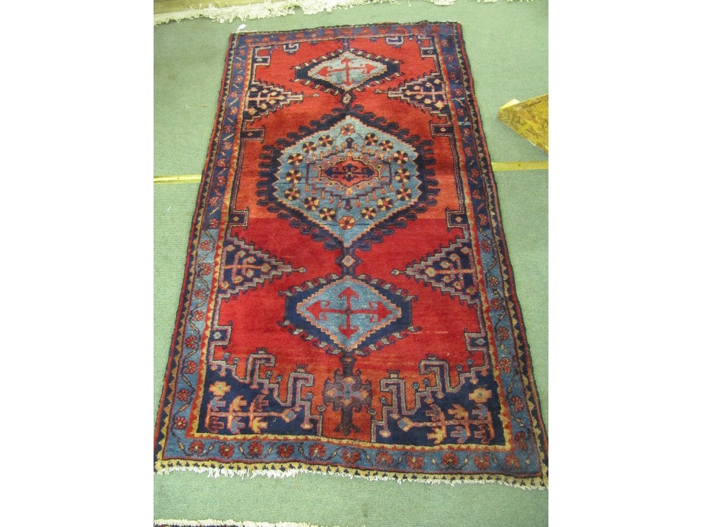 Appraisal: Iranian floor rug on a red and blue ground