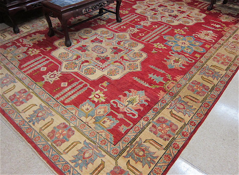 Appraisal: HAND KNOTTED ORIENTAL CARPET Pakistani Caucasian double geometric medallions design