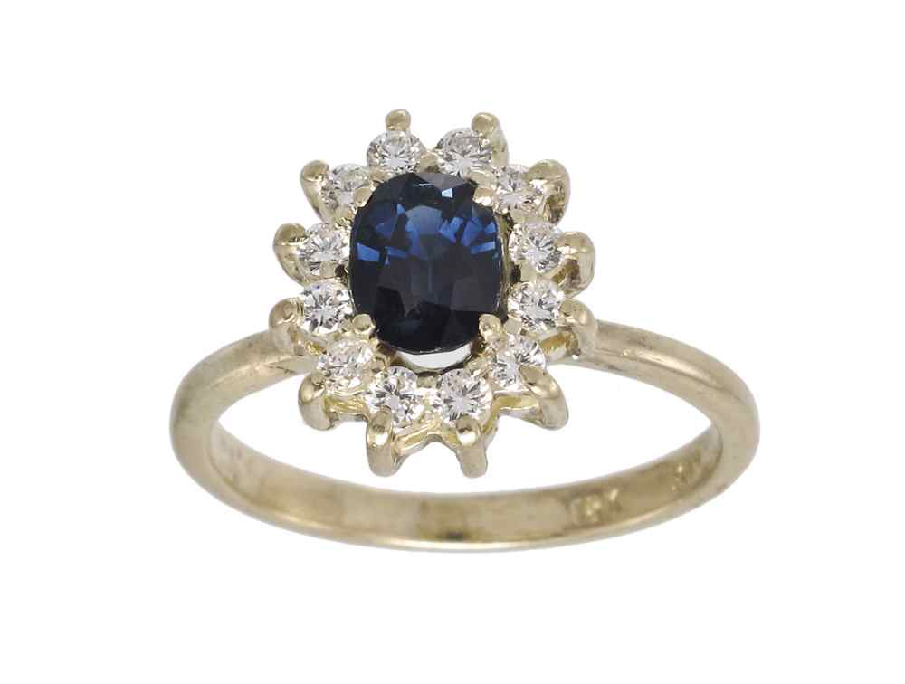 Appraisal: CLASSIC K SAPPHIRE DIAMOND RING K yellow ring centers an