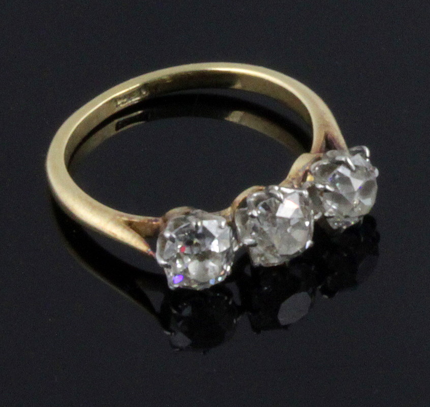 Appraisal: A three-stone diamond ring the stones claw set on an