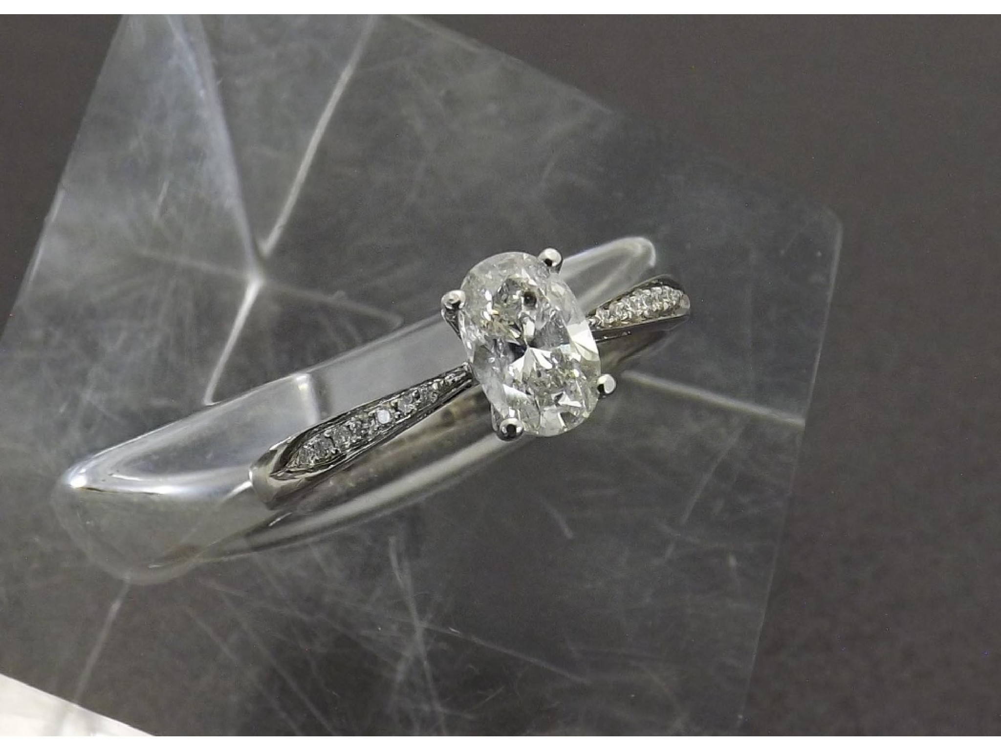 Appraisal: ct white gold oval-cut solitaire diamond ring with diamond set