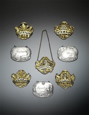 Appraisal: A set of five modern silver-gilt cast wine labels by