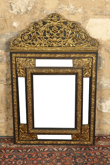 Appraisal: A TH CENTURY STYLE CUSHION FRAME GILDED METAL AND EBONISED