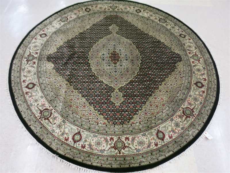 Appraisal: A ROUND ORIENTAL CARPET Persian Bijar design Herati floral motif