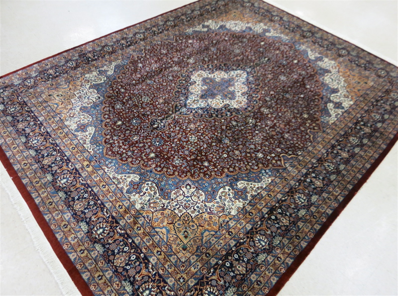 Appraisal: HAND KNOTTED ORIENTAL CARPET Indo-Persian floral and central floral medallion