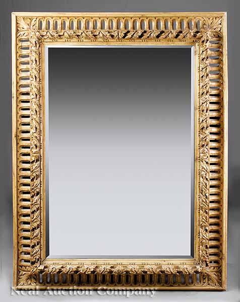 Appraisal: A George III-Style Carved and Reticulated Pine Mirror the frame