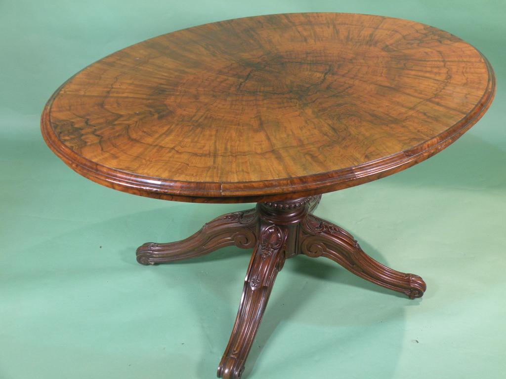 Appraisal: A mid Victorian walnut oval breakfast table with a moulded