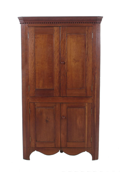 Appraisal: Diminutive American cherry corner cabinet circa dentil molded crown paneled