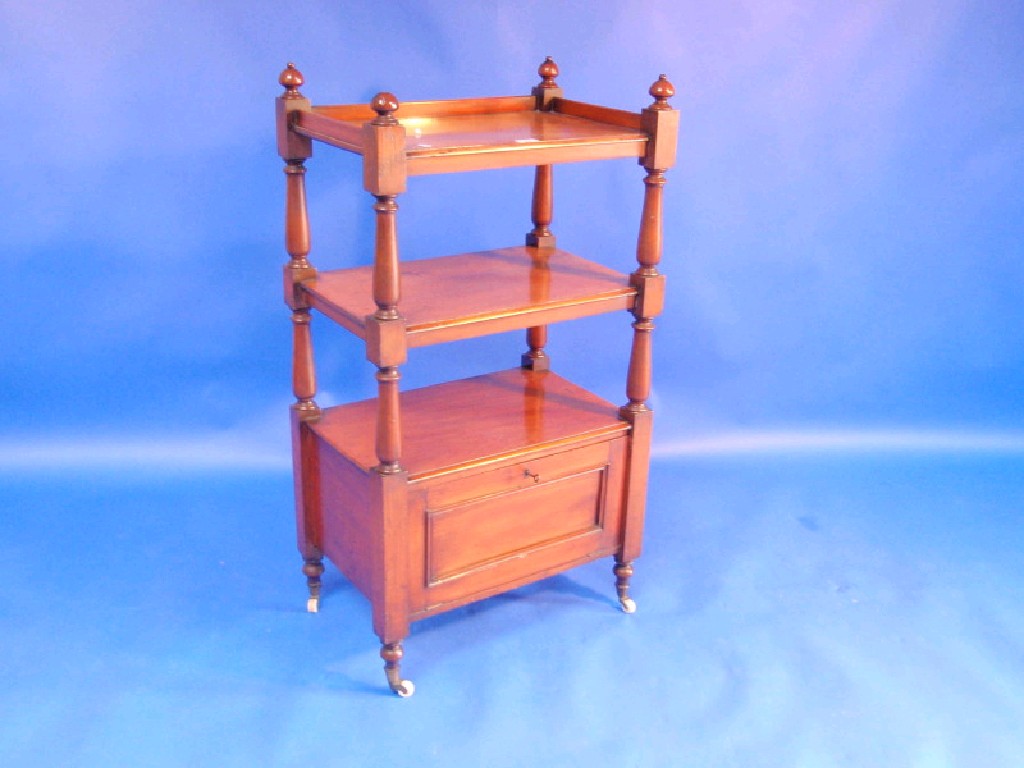 Appraisal: A Victorian mahogany three-tier whatnot with turned supports and panelled