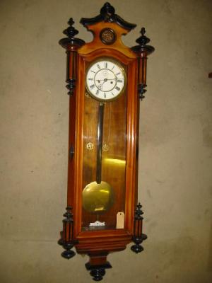 Appraisal: A VIENNA WALL CLOCK the twin weight driven movement with