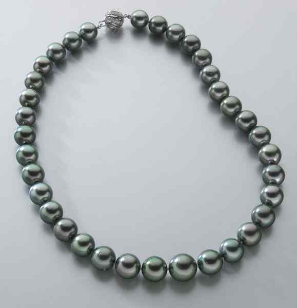 Appraisal: K gold diamond and Tahitian pearl necklacefeaturing mostly round slightly