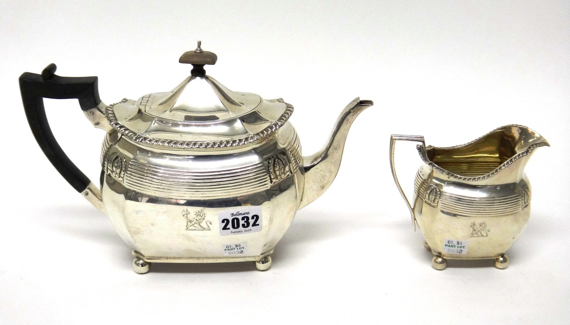 Appraisal: A silver teapot of curved cut cornered rectangular form decorated