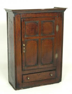 Appraisal: AN OAK WALL CUPBOARD of oblong form with moulded cornice