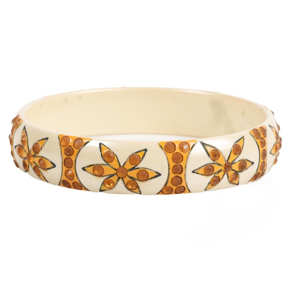 Appraisal: CREAM AND AMBER GEOMETRIC PATTERN MAIDENS CELLULOID SPARKLE BANGLE BRACELET