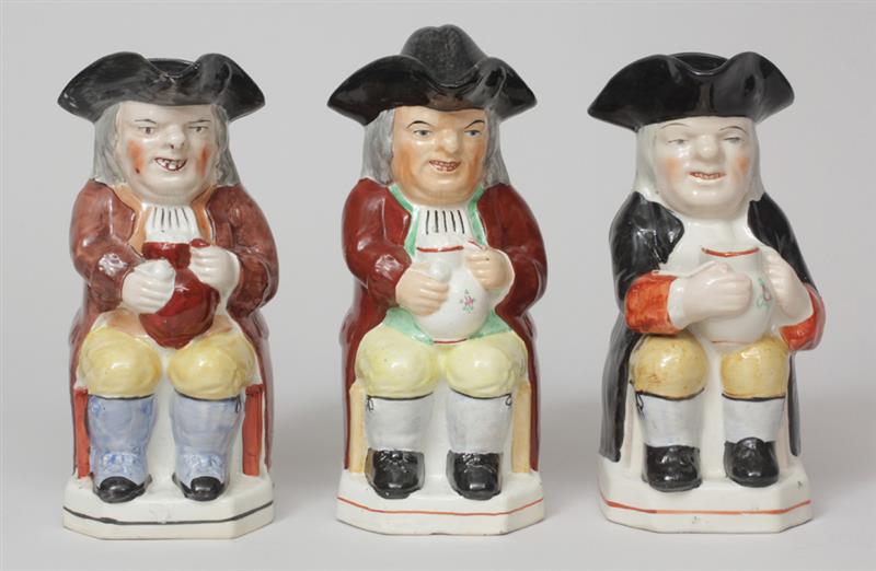 Appraisal: Group of Three Staffordshire Toby Jugs One with lid to