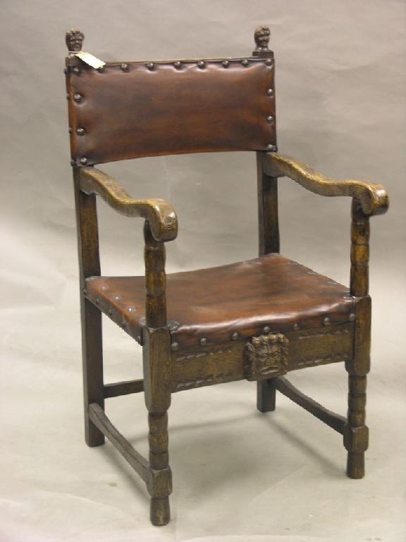 Appraisal: A solid dark oak carver chair seat and back upholstered