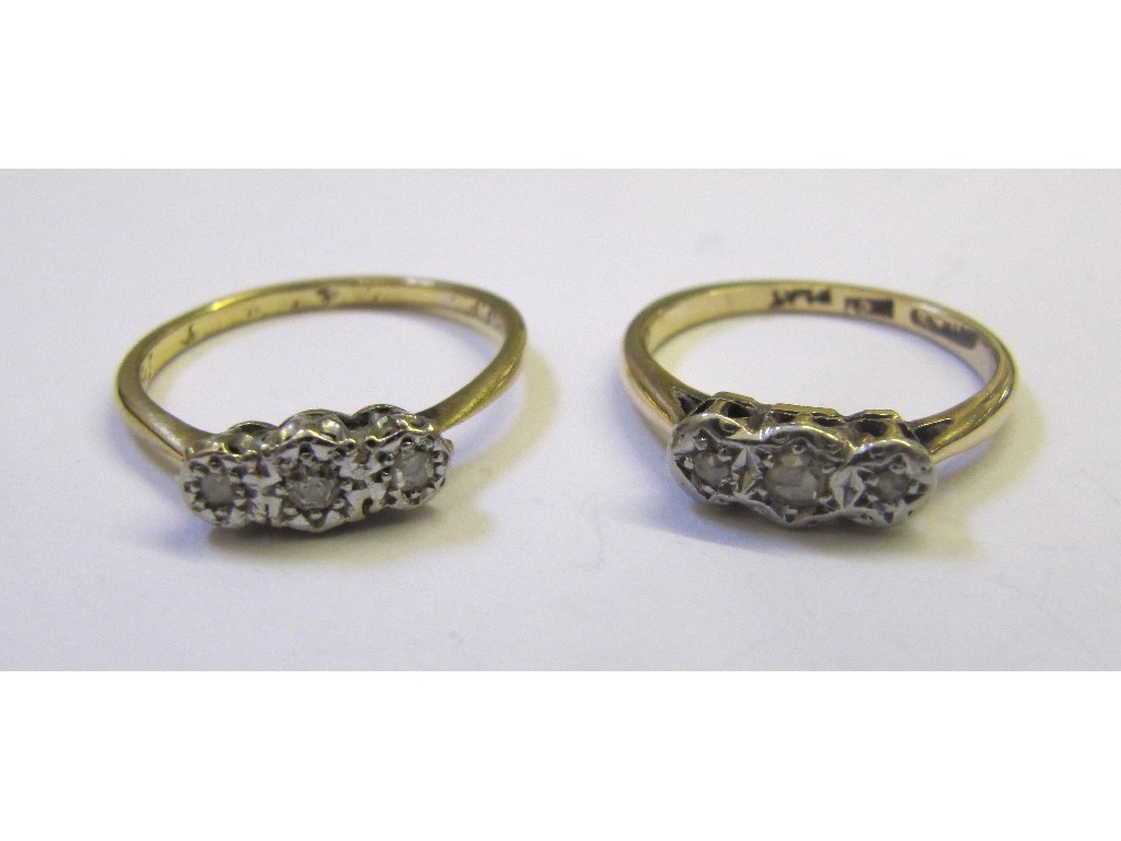 Appraisal: Two ct gold diamond three stone rings