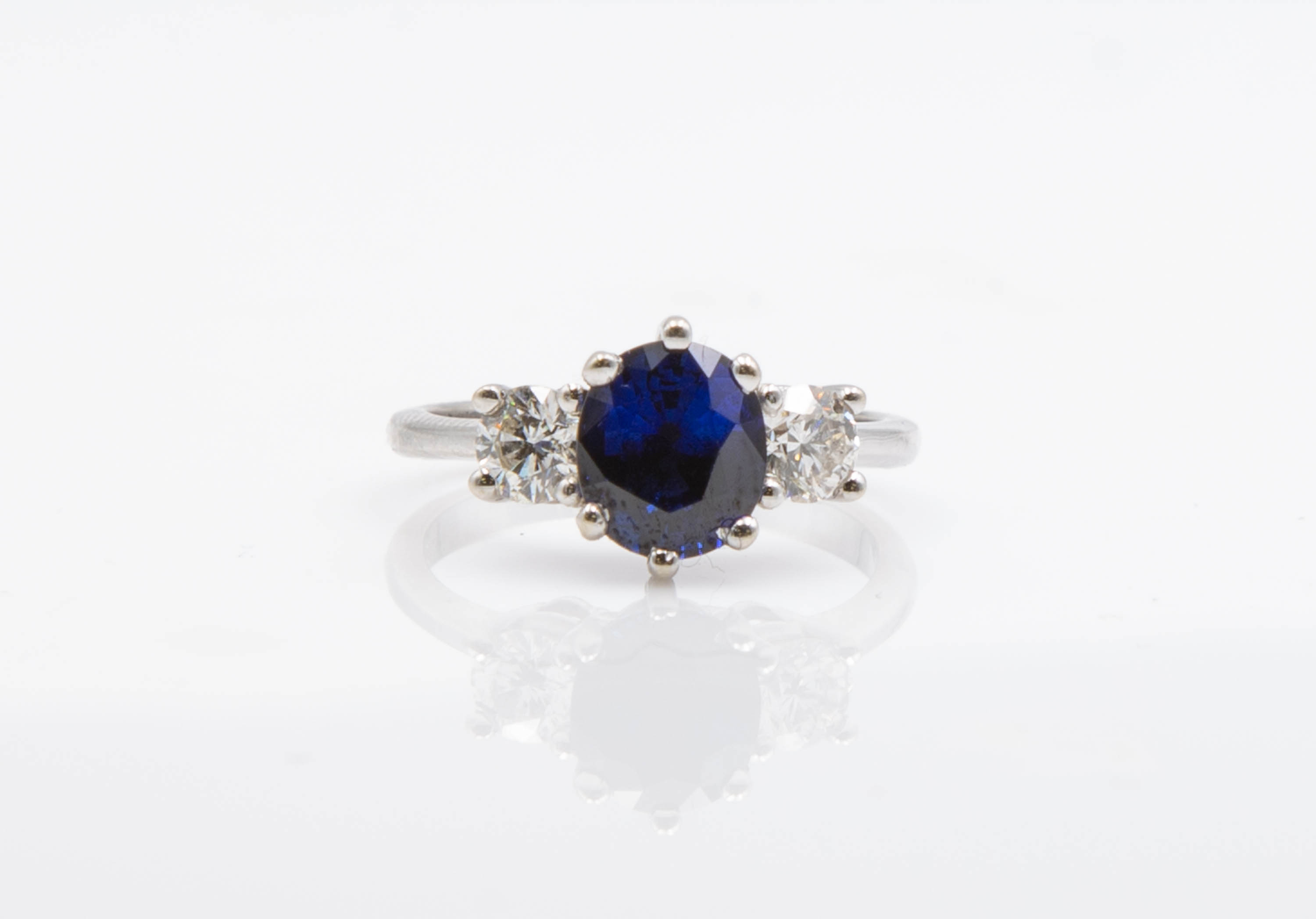 Appraisal: K GOLD SAPPHIRE AND DIAMOND RING A kt gold three