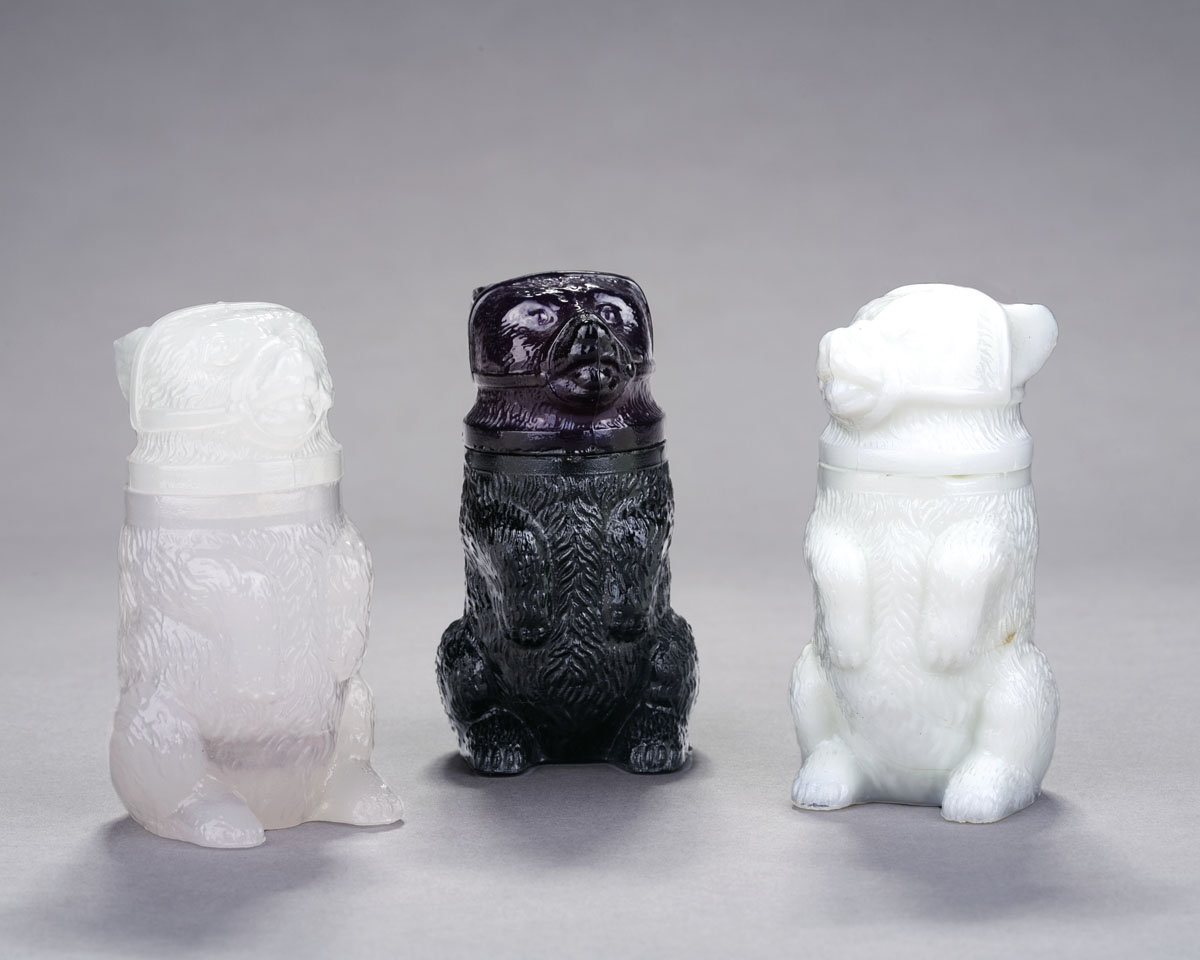 Appraisal: THREE PRESSED COLORED 'BEAR' JARS BOSTON SANDWICH GLASS COMPANY CIRCA