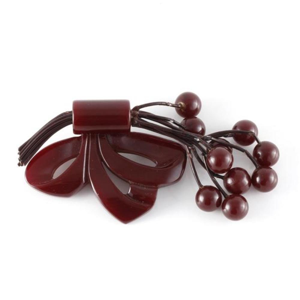 Appraisal: VINTAGE BAKELITE CARVED WINE COLOR BOW AND DANGLING FRUIT SPRAY